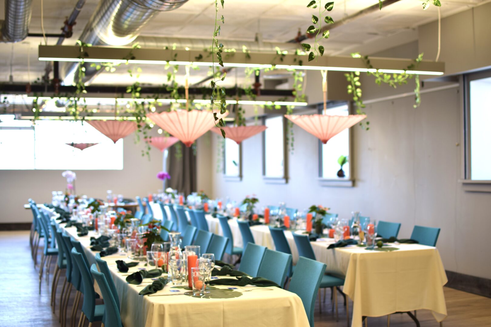 The fourth floor at 10C Shared Space is full of chairs and tables, along with colourful décor and upside-down umbrellas hanging from the ceiling. 